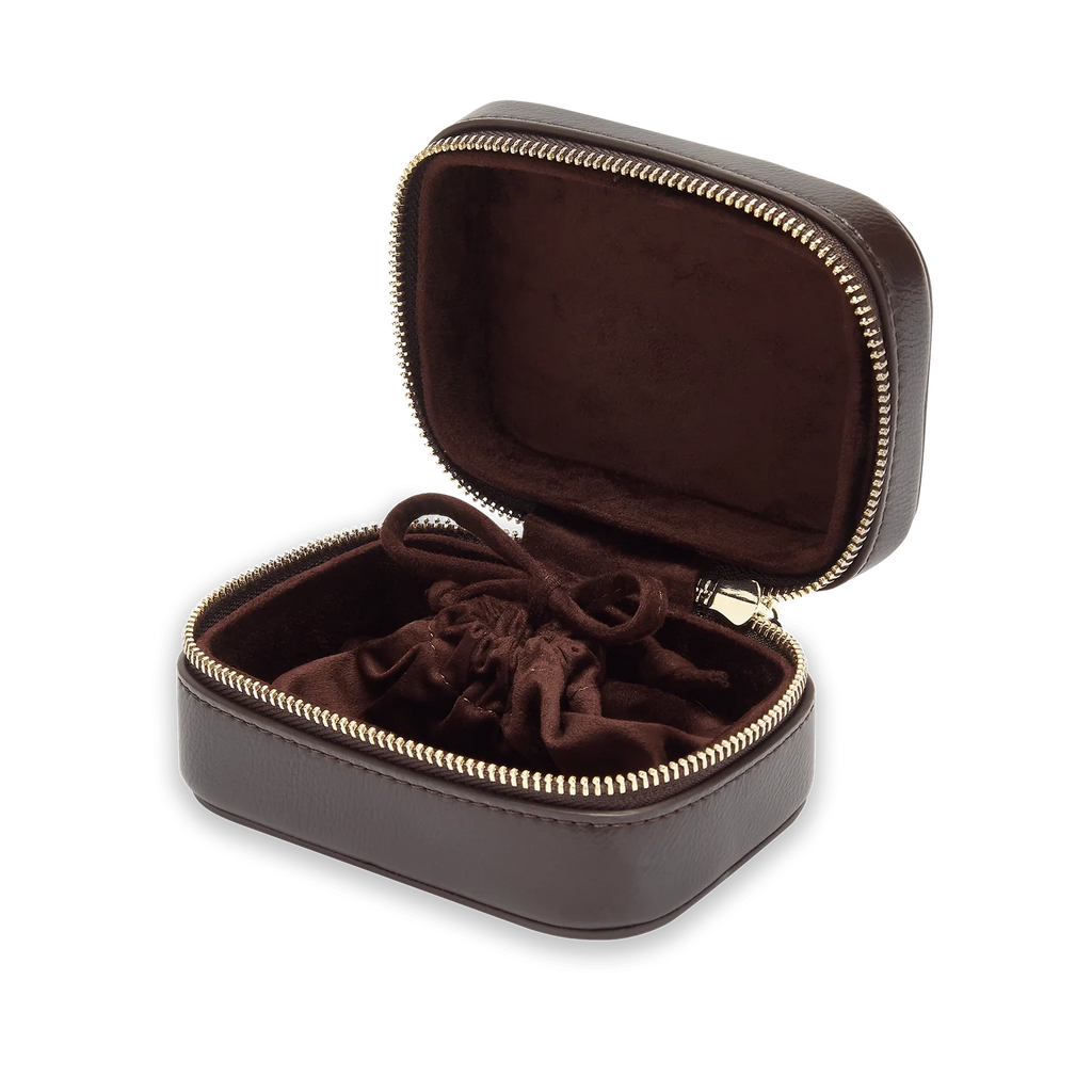 Brown case with velvet interior on a white background